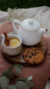 Placing Biscuits Beside Glass of Lemon Cinnamon Tea, Cozy Aesthetic Tea Time and Relaxing Beverage Concept