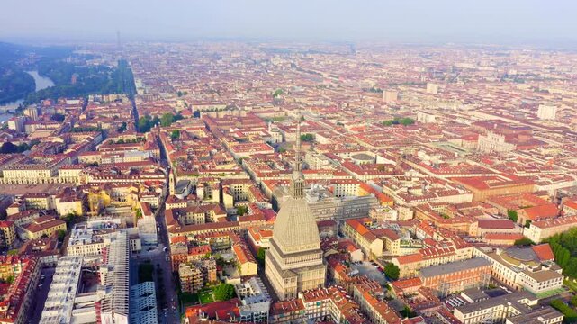 Turin, Italy. Flight over the city. Mole Antonelliana - a 19th-century building with a 121 m high dome and a spire. Drone footage