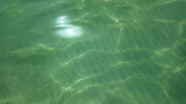 Calming turquoise sea water surface background