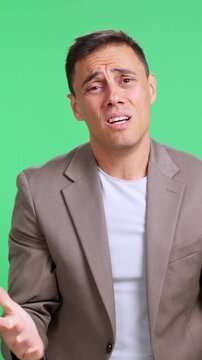 Desperate man pleading and begging on green screen background