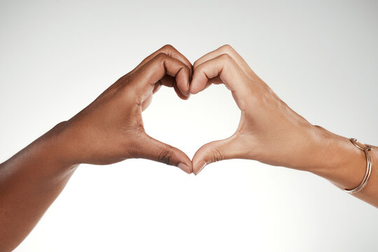 Heart hands, support and partner with people in studio for connection, thank you and respect. Community, collaboration and cooperation with friends on white background for trust, team and love