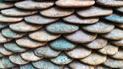 Fototapeta premium Textured Arrangement of Smooth River Stones in Natural Colors