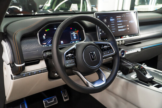 Luxury interior of a Tank 700 Е1 Edition One 3.0T V6 Hybrid 9AT 4WD. Leather interior, steering wheel, dashboard, gear shifting, armrest, front seats. Chinese automobile brand, of a Great Wall Motors.