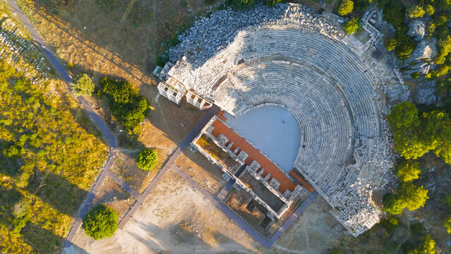 Gelemis, Turkey. Top down aerial view of Patara Ancient Theatre, cavea with 38 rows and stage building, archaeological site of Lycian capital city. Aerial View