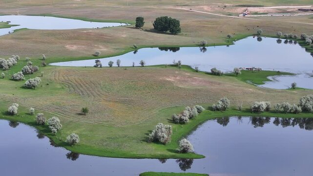 A quadcopter view of picturesque lakes in the steppe on a spring day near the Kazakh city of Almaty.