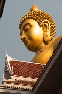 Giant golden Buddha statue at Wat Paknam Phasi Charoen, Bangkok, Thailand.