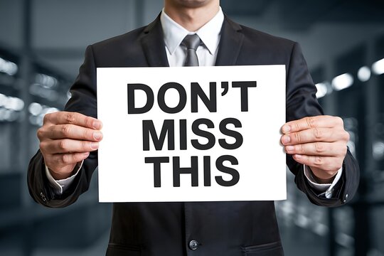Businessman holding sign with urgent message