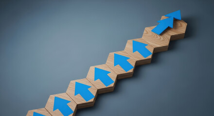 Fototapeta premium Business Growth Step Progression Ascending Blue Arrows on Wooden Hexagons Improvement Development Upward Trend Advancement Direction Progress