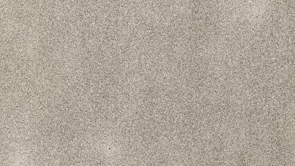 Fototapeta premium ​Top view of fine brown sand texture background, seamless grainy desert sand or stone surface for design.