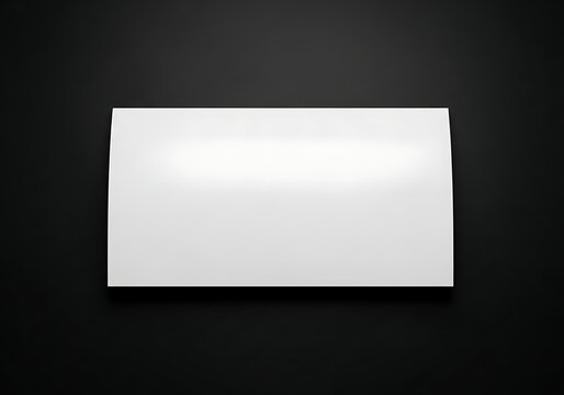 Isolated rectangular white sticker with soft drop shadow on black surface, ideal for product branding and label mockups