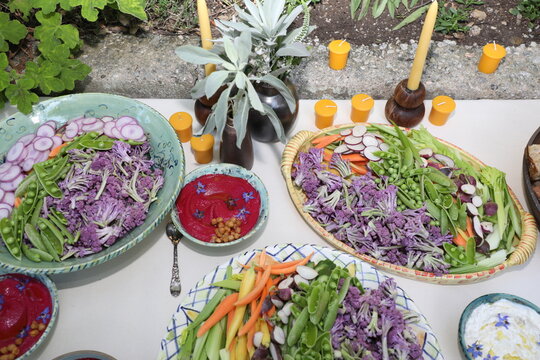 Buffet spread of crudiites and dips.