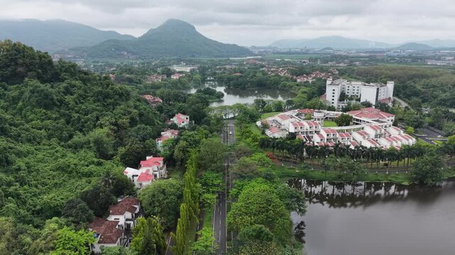 Cinematic drone shots of lake in the mountains located at IIT Guwahati 