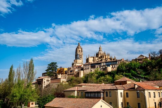 The area within the city walls around the castles and churches of the fortified city of Segovia in Spain on a spring weekday