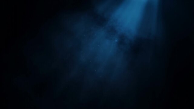 Blue Volumetric Light Rays Descending Through Dark Atmospheric Fog