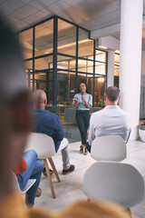 Fototapeta premium Audience, speaker and woman with speech for seminar, corporate training and sales negotiation workshop. Office, business people and presenter with advice for communication skills, coaching and mic