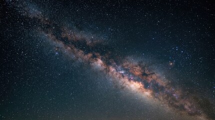 Fototapeta premium The image showcases the Milky Way galaxy, a vast spiral galaxy filled with countless stars and interstellar dust.