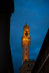 Obraz premium Old heritage urban Piazza tower building in Florence, Italy at night dusk