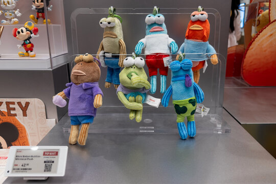 PENANG, MALAYSIA - FEB 09, 2026: Close up of a person holding Bikini Bottom Buddies collectible plush blind box inside Pop Mart retail store.