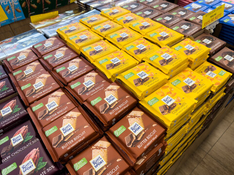 LANGKAWI, MALAYSIA - MAR 18, 2026: Stacks of Ritter Sport Butter Biscuit and Cornflakes chocolate bars displayed on a supermarket shelf.