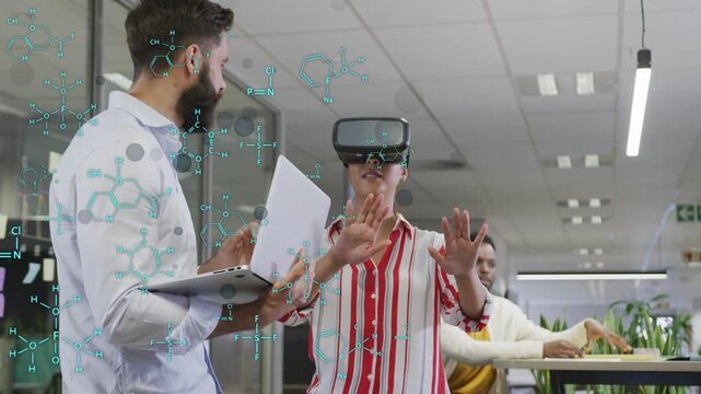 Woman testing VR headset doing push or pull as colleague on laptop guiding tech demo, cyan graphics