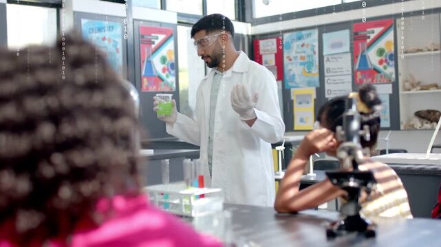 Male teacher lifting beaker and speaking to teach chemistry, binary overlay growing across frame