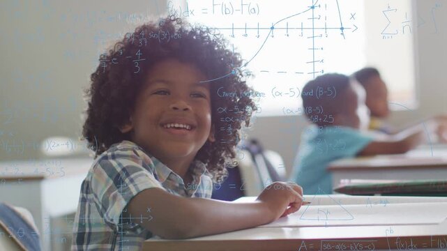 Boy at desk holding pencil as camera zooming, math overlays appearing, highlighting learning