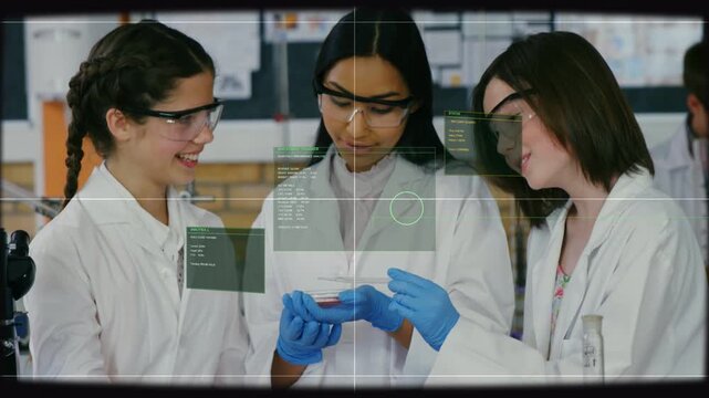Center student rotating petri dish, peers leaning and pointing, HUD overlay marking specimen in lab