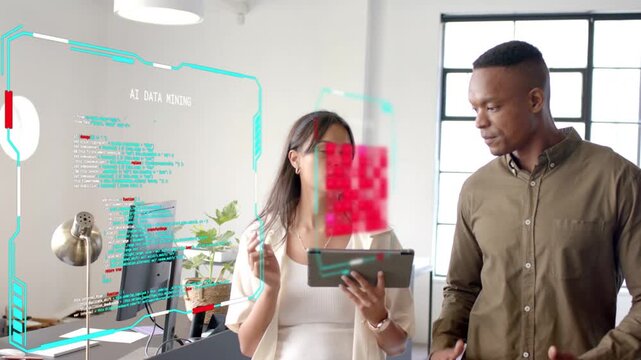 Woman holding tablet initiating AR overlay showing code, red-pixel block for tech demo, man leaning