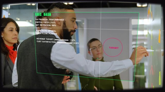 Lead tapping marker, writing on glass while EXEC_DASH aligning Q4 to pink TARGET, driving finance