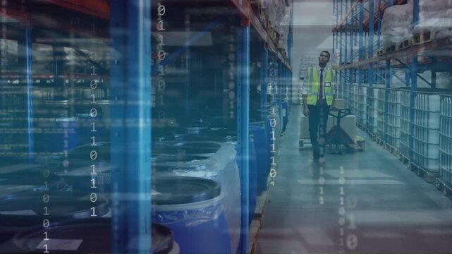 Warehouse worker walking from far end pulling pallet jack, initiating binary scans over blue drums