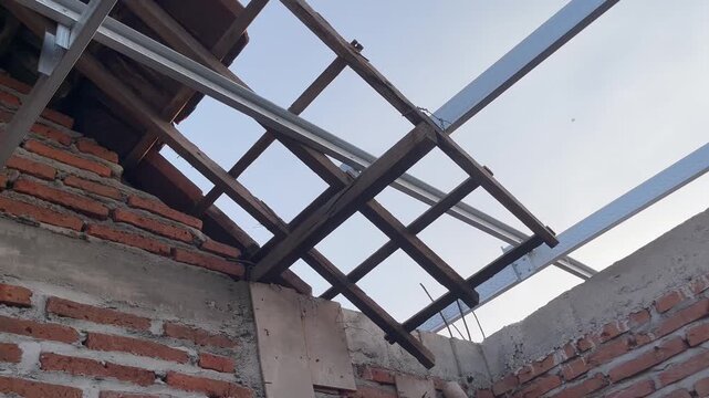 Lightweight steel roof structure on brick wall