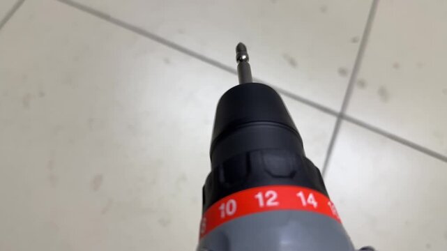 electric screwdriver rotating in close up, cordless power tool demonstrating spinning motion