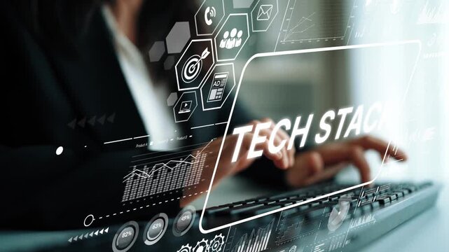 Professional working on a digital tech stack interface with innovative technology symbols and data analytics visuals in a modern workspace. Asymptotic smart data analytic.
