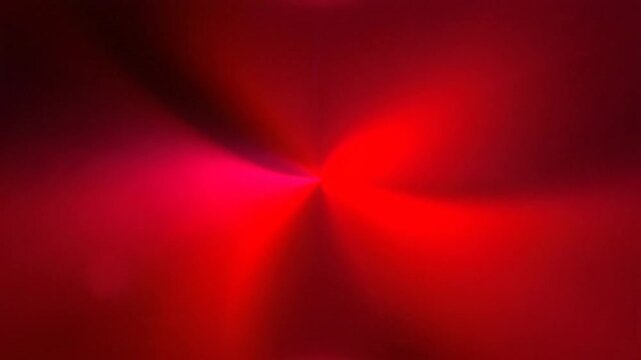 Abstract red light radiating from a central point creating a dramatic, immersive background with lens flares