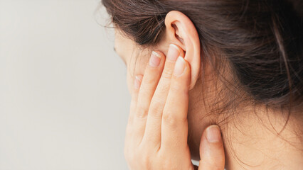 Fototapeta premium Young woman suffering from earache