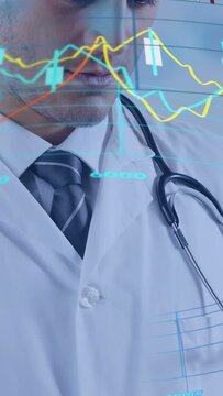 Vertical video: Doctor tapping screen, lifting gaze to overlaid charts and confirming medical data