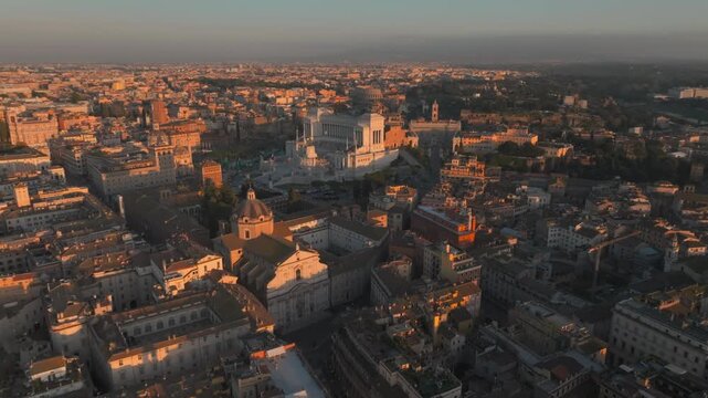 Vittoriano monument Aerial sunset view of Rome cityscape at golden hour, Victor Emmanuel II drone
