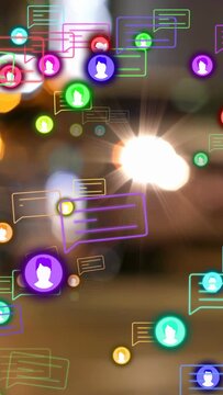 Vertical video: Bright flare sparking color icons and bubbles drifting, clustering, showing alerts