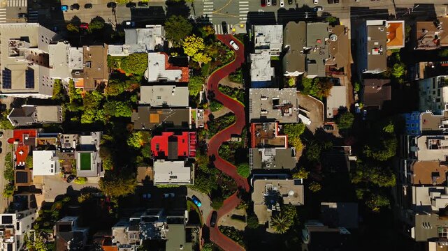 Slow aerial view of Lombard Street and residential San Francisco neighborhood