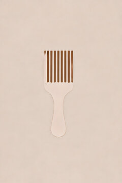 Minimal beauty composition featuring wooden hair pick comb with clean shadows and neutral pastel tones.