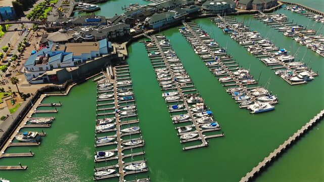 Drone view over San Francisco marina with rows of docked boats