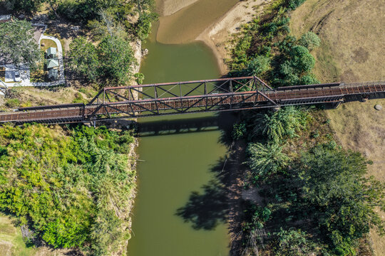 Aerial image of the Paterson railway bridge spanning the Hunter River in New South Wales Australia. Drone photograph captures the historic rail bridge crossing the winding river.