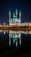 Fototapeta premium Illuminated mosque with turquoise domes and minarets reflected in dark water