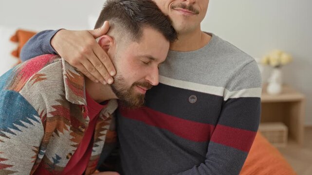 Two men cuddle on couch with one resting head on partner chest while partner cups his head with hand in building; tenderness love support.