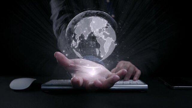 A glowing globe is held in a hand, showcasing various languages. This image represents global communication, diversity, and the interconnected world through technology. Qubit