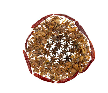 Top view of assorted dried spices arranged in a circular wreath on Transparent background, featuring star anise, dried red chili peppers and dried flower petals, minimal flat lay.