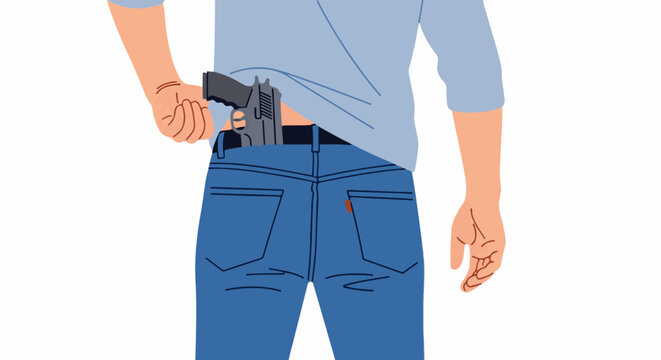 A person tucks a handgun into the back of their blue jeans waist band