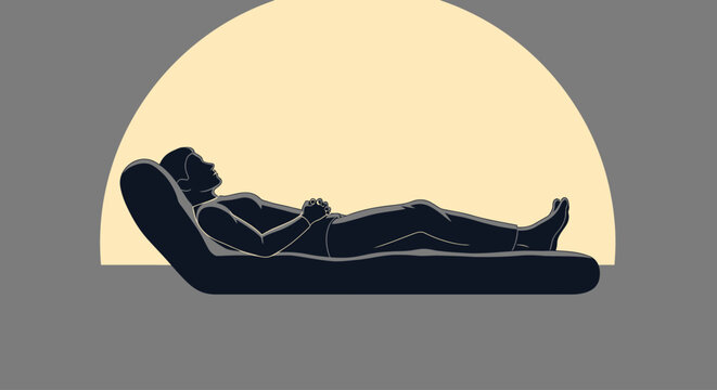 Person lying on a massage table.