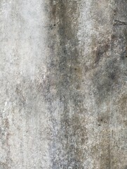 Obraz premium Weathered concrete wall with gray streaks and subtle texture