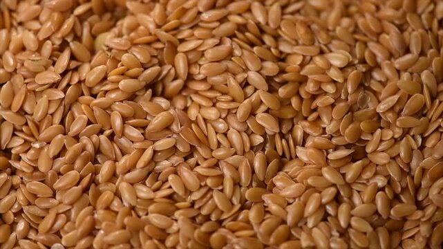 Linen seeds, Linseed. Flaxseed background, closeup. Flax seeds, Linen seed. Healthy vegan food backdrop rotating, diet. Top view, flat lay, macro shot